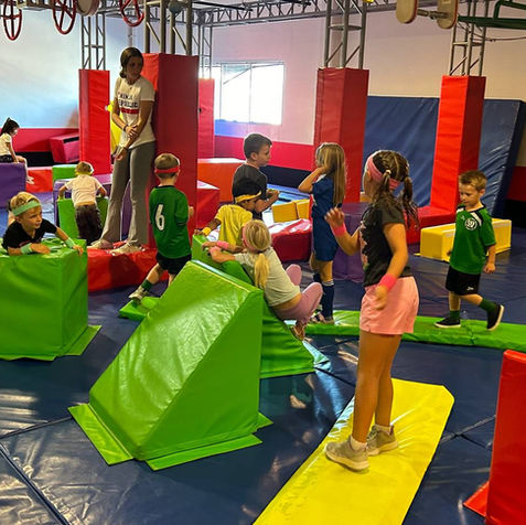 Children playing together in the gym