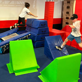 Bright green foam blocks and ninja challenges at Ninja Republic in San Mateo, CA